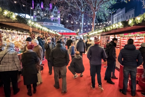 Leicester Square Christmas Market. People Shopping at  stalls.